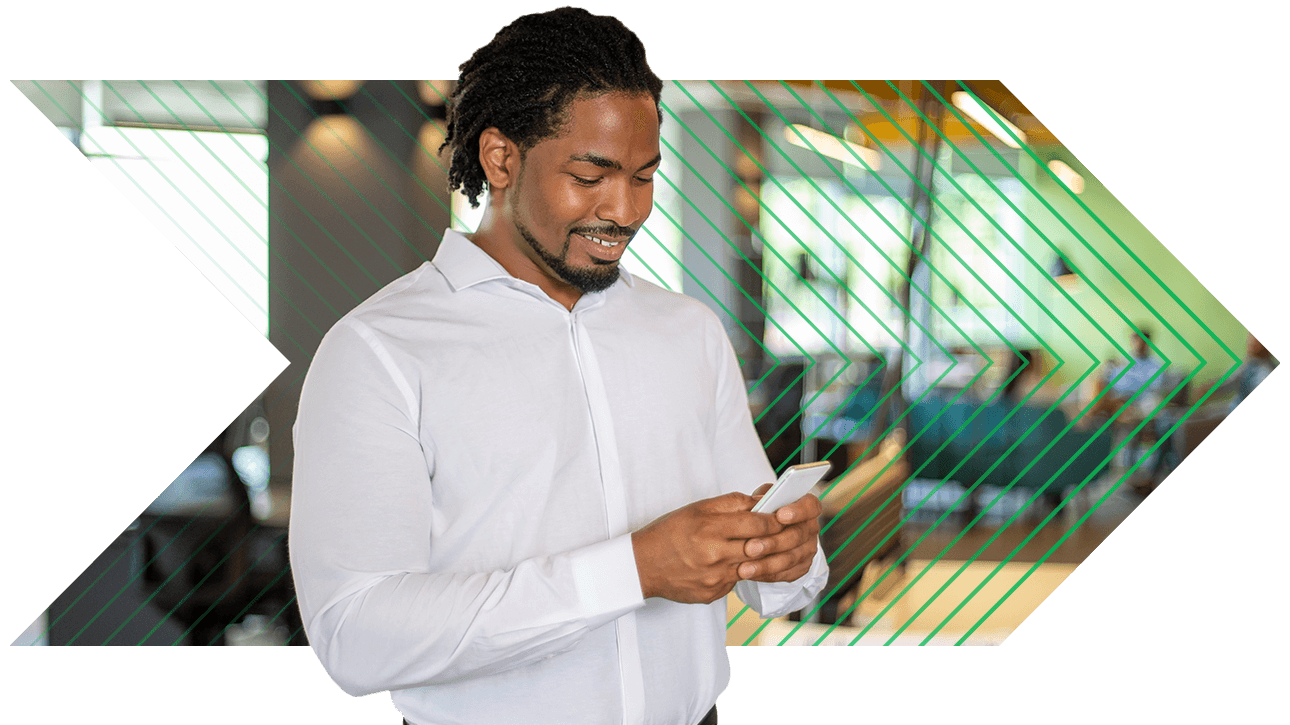 Male professional using Paycom's ESS app on his phone